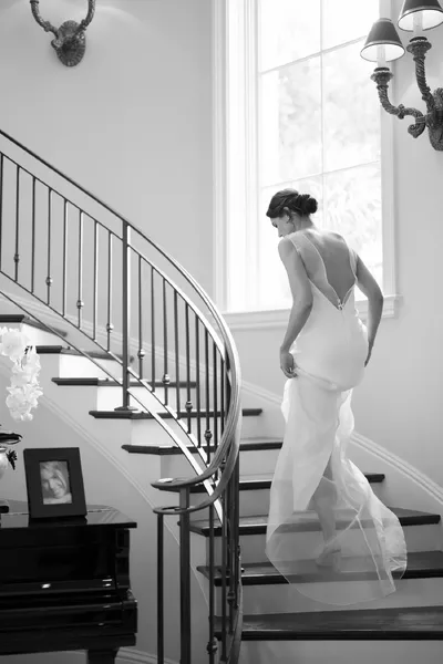 Bride on elegant staircase - Editorial wedding cinematography by Pineapple Films